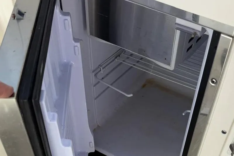 Slide: The Image of Open refrigerator in Chaparral 267 SSX boat, year 2018. - 16