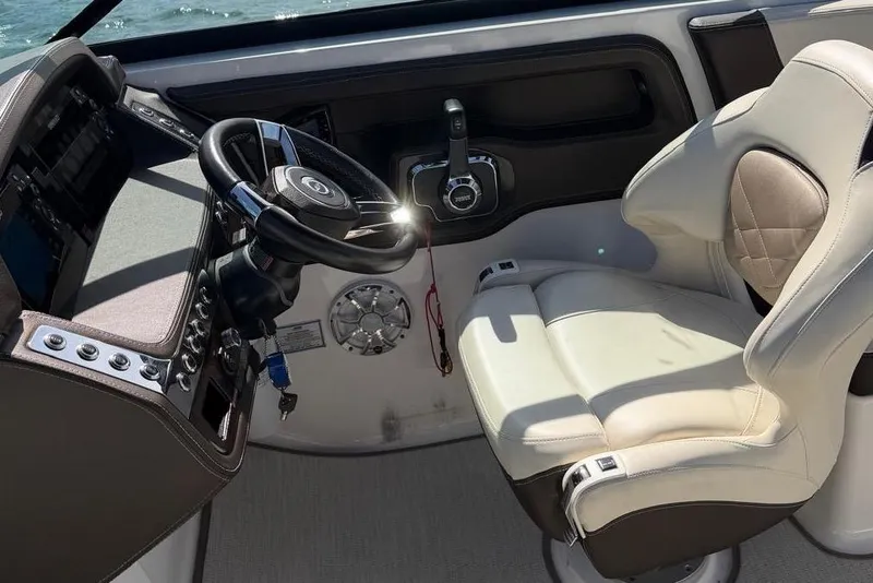 Slide: The Image of Cockpit of 2018 Chaparral 267 SSX boat with steering wheel and captain's chair. - 6