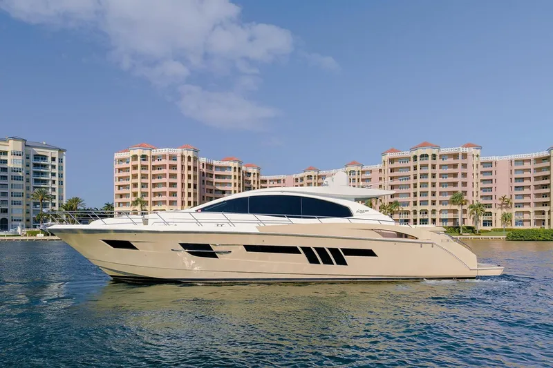 Slide: The Image of 2013 Lazzara 64 yacht cruising near waterfront buildings under a clear sky. - 3