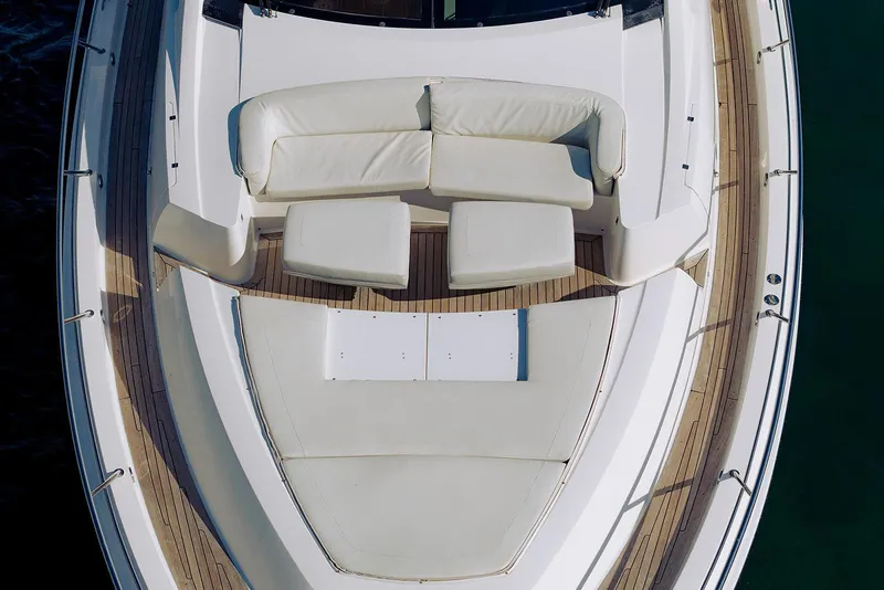 Slide: The Image of Luxurious 2013 Lazzara 64 yacht deck with white seating and wooden flooring. - 5