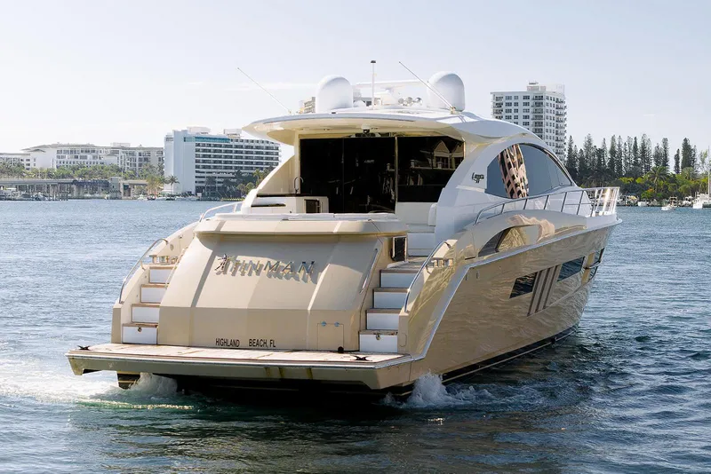 Slide: The Image of Luxury 2013 Lazzara 64 yacht cruising near urban waterfront buildings. - 7