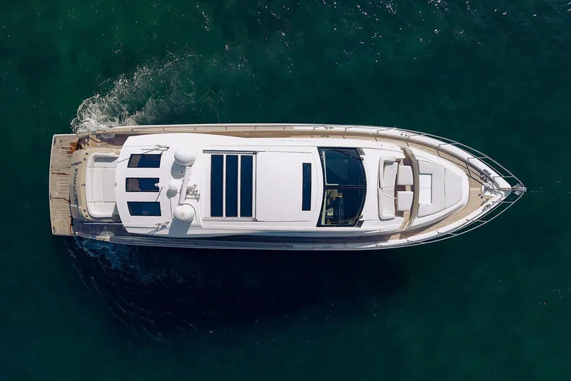 Slide: The Image of Aerial view of 2013 Lazzara 64 yacht cruising on clear water. - 9