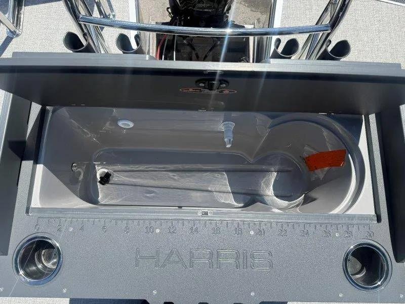 Slide: The Image of Harris Cruiser 210 FC 2025 boat cooler with ruler and cup holders. - 26