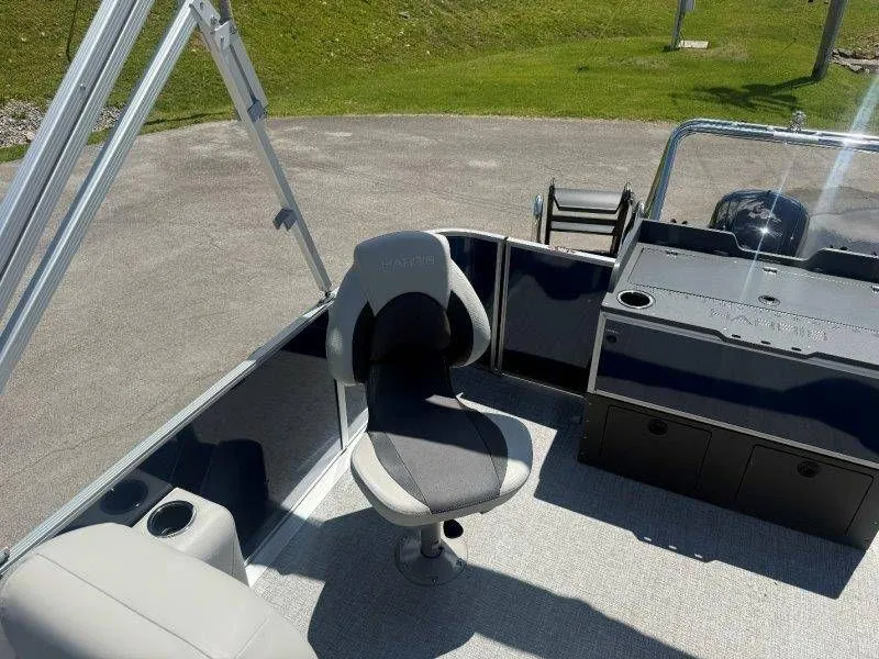 Slide: The Image of Interior of 2025 Harris Cruiser 210 FC with seat and console. - 28