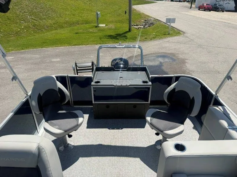 Slide: The Image of Interior of 2025 Harris Cruiser 210 FC with seating and helm console. - 33