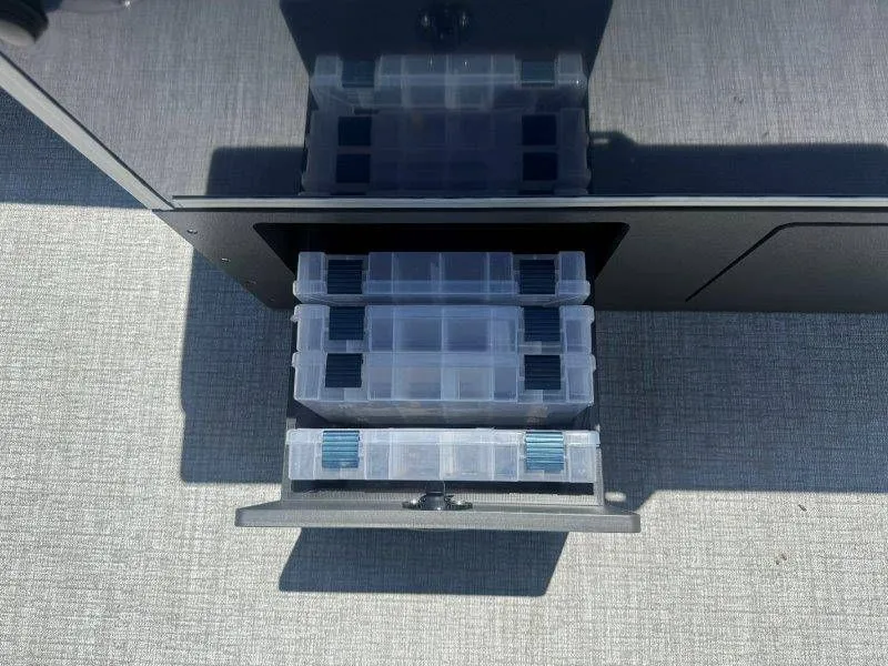Slide: The Image of Harris Cruiser 210 FC 2025 with transparent storage boxes. - 35