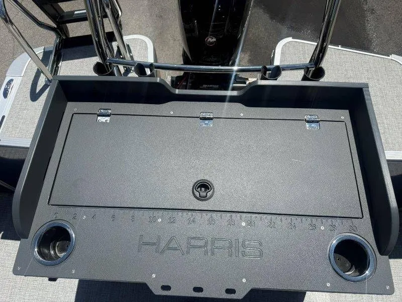 Slide: The Image of Harris Cruiser 210 FC 2025 boat console with cup holders and measurement scale. - 38
