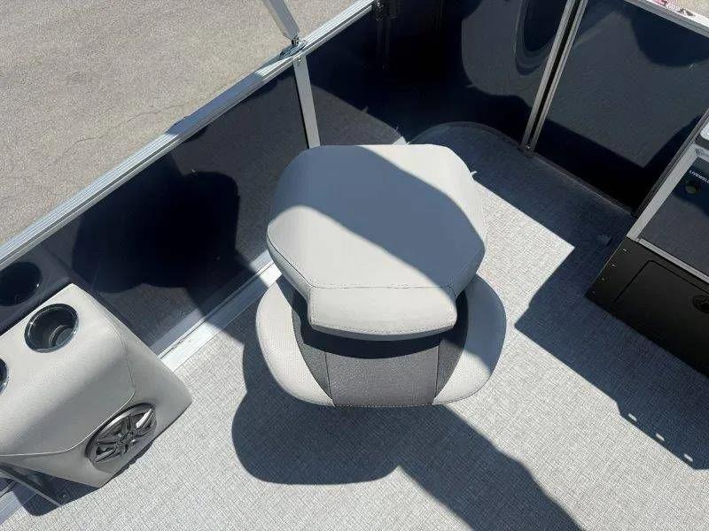 Slide: The Image of Interior of 2025 Harris Cruiser 210 FC with gray seat and speaker. - 39