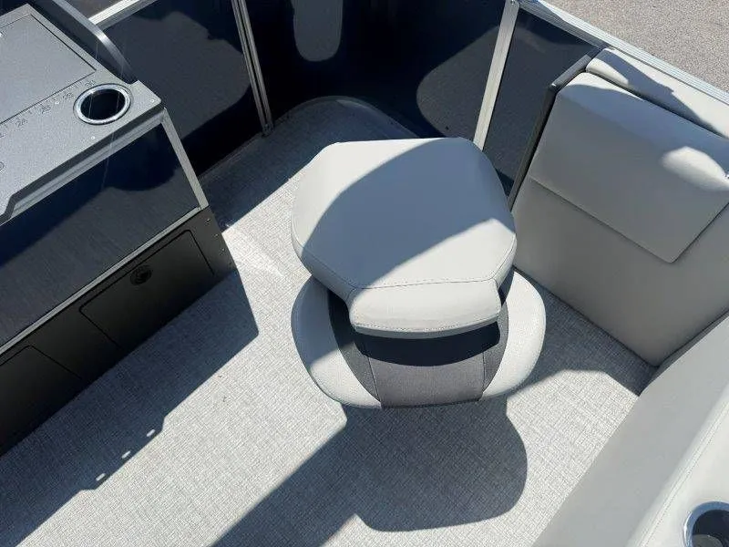 Slide: The Image of Interior of 2025 Harris Cruiser 210 FC with gray seat and console. - 40