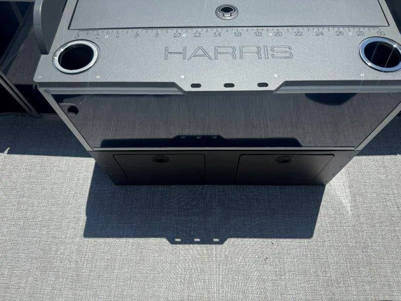 Slide: The Image of Harris Cruiser 210 FC 2025 boat console with cup holders. - 43