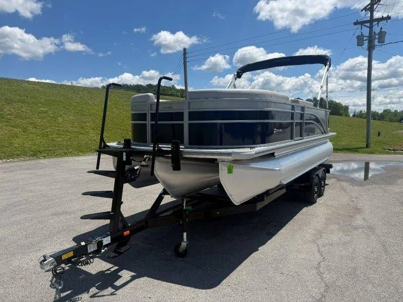 Slide: The Image of 2025 Harris Cruiser 210 FC pontoon boat on trailer in sunny weather. - 48