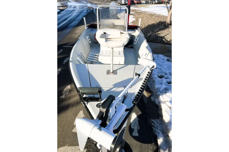 Slide: The Image of 2018 Boggy Creek Stryker 16 boat on snowy driveway, featuring sleek design and modern equipment. - 12