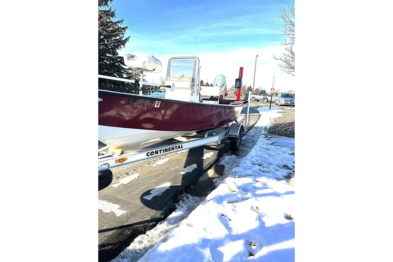 Slide: The Image of 2018 Boggy Creek Stryker 16 boat on trailer, parked on snowy pavement. - 14