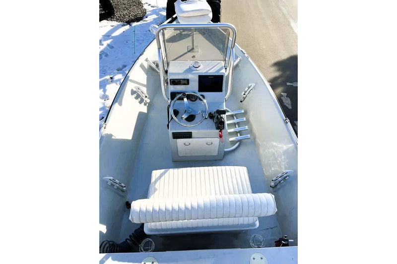 Slide: The Image of 2018 Boggy Creek Stryker 16 boat interior with steering console and seating. - 15