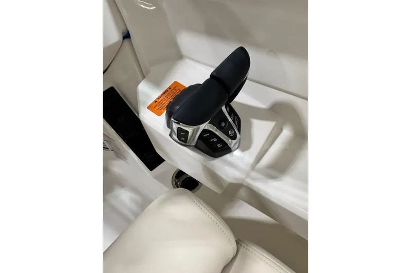 Slide: The Image of Throttle control of 2026 Robalo R257 Dual Console boat, featuring ergonomic design. - 12