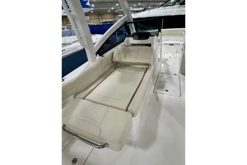 Slide: The Image of 2026 Robalo R257 Dual Console boat interior with white seating and sleek design. - 14