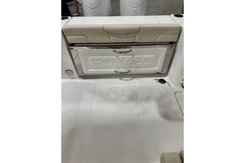 Slide: The Image of 2026 Robalo R257 Dual Console boat interior with storage compartment. - 9
