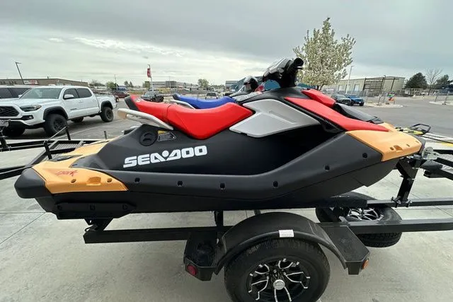 Slide: The Image of 2026 Sea-Doo PWC SPARK on trailer, black and red, side view. - 18