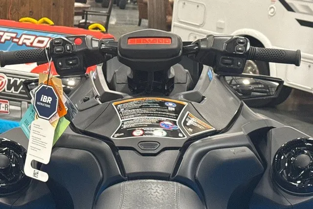 Slide: The Image of Close-up of a Sea-Doo PWC RXT X 325 cockpit with handlebars and controls. - 13