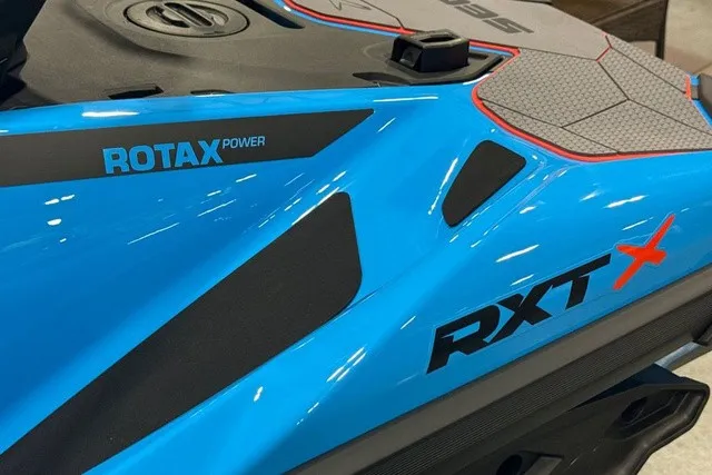 Slide: The Image of Close-up of a blue Sea-Doo PWC with "ROTAX Power" and "RXT X" markings. - 26