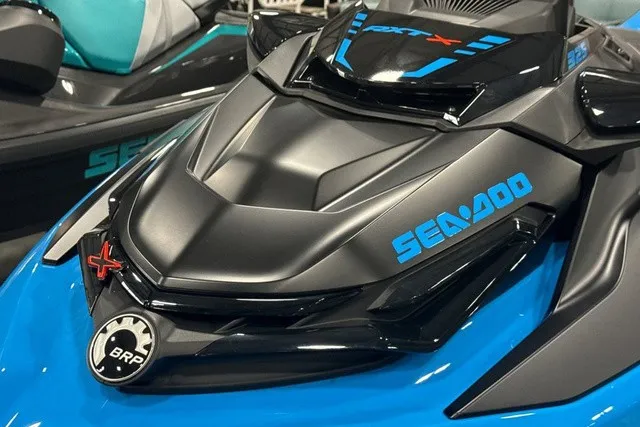 Slide: The Image of Close-up of a 2026 Sea-Doo PWC RXT X 325 AUD BE IBR 26 in blue and black. - 23