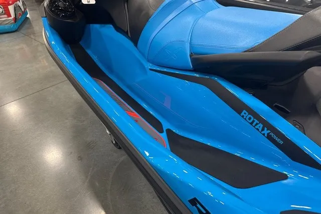 Slide: The Image of A 2026 Sea-Doo PWC RXT X 325 AUD BE IBR 26 in bright blue with black accents. - 11