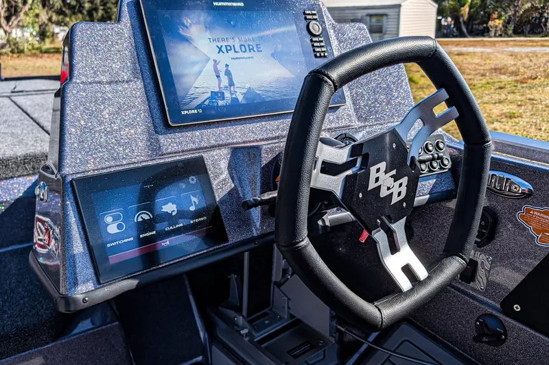Slide: The Image of 2026 Bass Cat Lynx STS dashboard with advanced navigation and control systems. - 12
