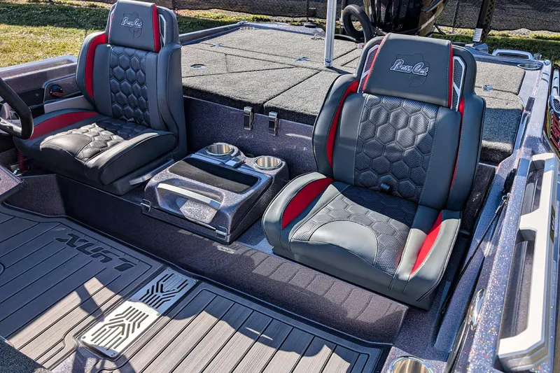 Slide: The Image of 2026 Bass Cat Lynx STS boat interior with stylish seats and cup holders. - 14