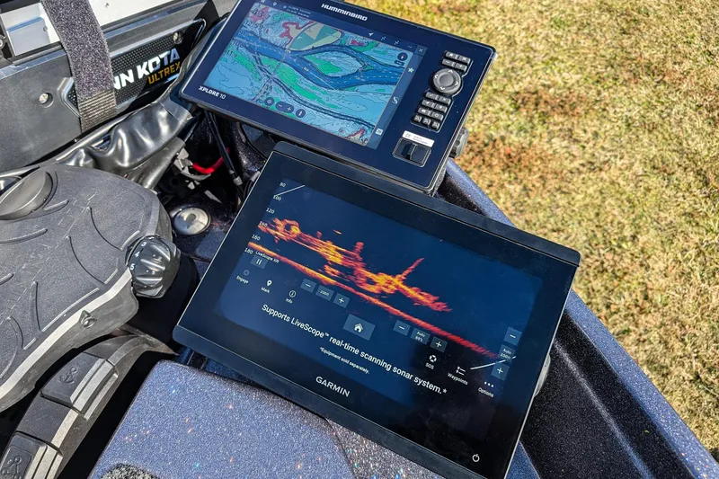 Slide: The Image of 2026 Bass Cat Lynx STS boat with advanced Garmin and Humminbird sonar displays. - 21