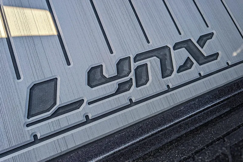 Slide: The Image of Close-up of 2026 Bass Cat Lynx STS logo on textured surface. - 22