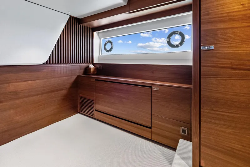 Slide: The Image of Luxurious interior of 2024 Princess Y72 Motor Yacht with wooden finishes and ocean view. - 25