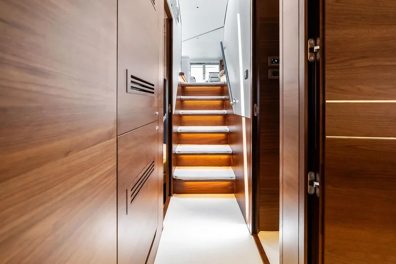 Slide: The Image of Luxurious wooden interior of 2024 Princess Y72 Motor Yacht with elegant staircase. - 36