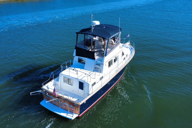 Slide: The Image of 2006 Albin 40 North Sea Cutter cruising on calm blue waters. - 14