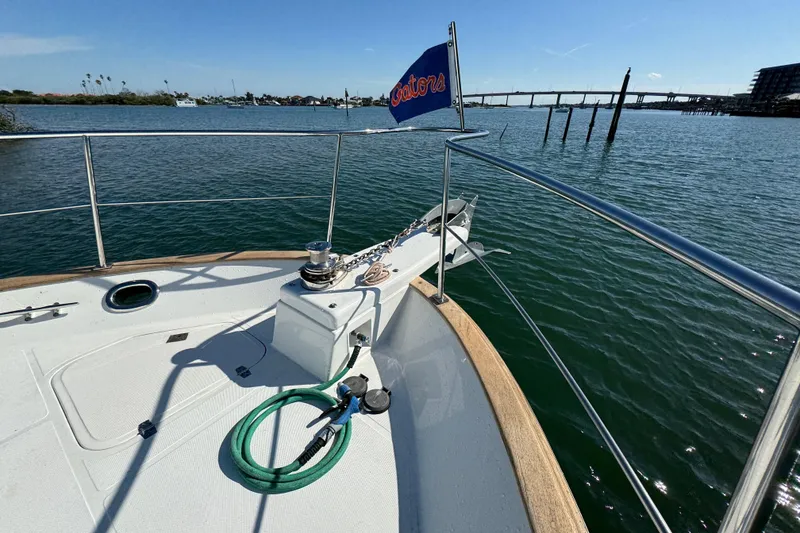 Slide: The Image of Bow view of 2006 Albin 40 North Sea Cutter on calm waters, featuring deck equipment. - 18
