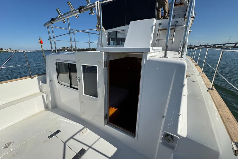 Slide: The Image of 2006 Albin 40 North Sea Cutter deck view with open cabin door. - 20