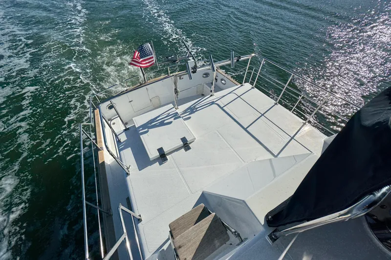 Slide: The Image of 2006 Albin 40 North Sea Cutter cruising with American flag on deck. - 24