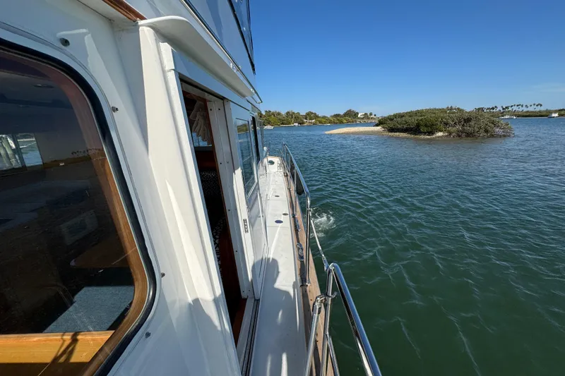 Slide: The Image of 2006 Albin 40 North Sea Cutter cruising near a small island in calm waters. - 26