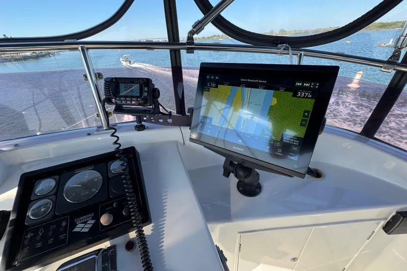 Slide: The Image of Helm of 2006 Albin 40 North Sea Cutter with navigation equipment and scenic water view. - 32
