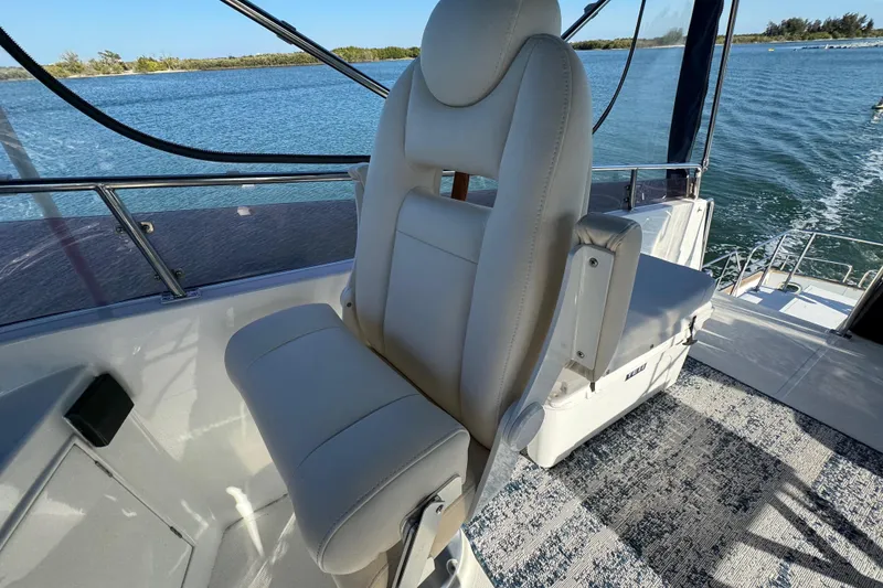 Slide: The Image of Captain's chair on 2006 Albin 40 North Sea Cutter, overlooking serene waters. - 36