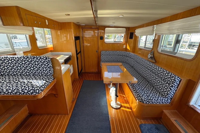 Slide: The Image of Interior of 2006 Albin 40 North Sea Cutter with patterned seating and wooden finishes. - 44