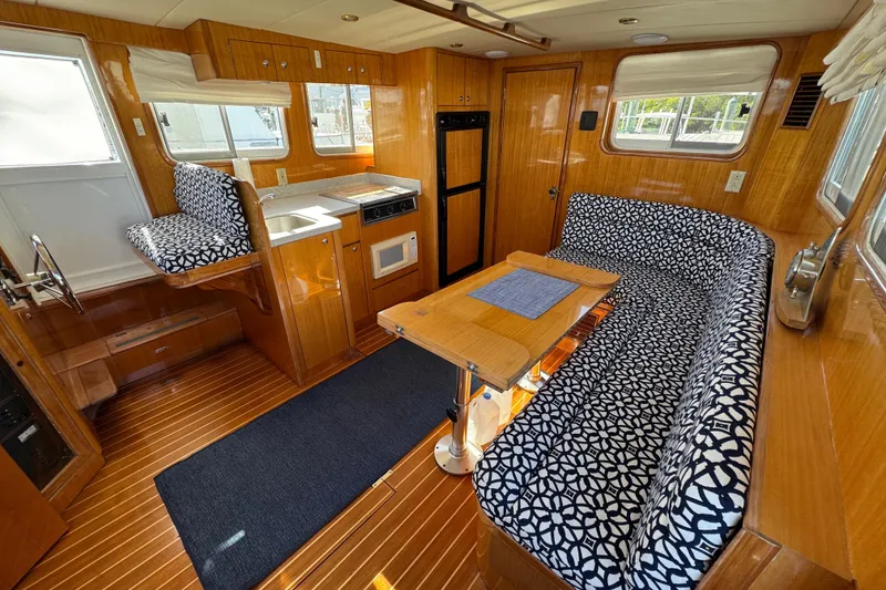 Slide: The Image of Interior of 2006 Albin 40 North Sea Cutter with patterned seating and wooden finishes. - 45