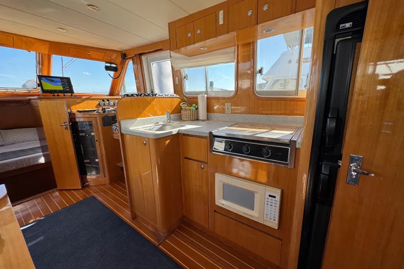 Slide: The Image of Interior of 2006 Albin 40 North Sea Cutter with kitchen and navigation area. - 47