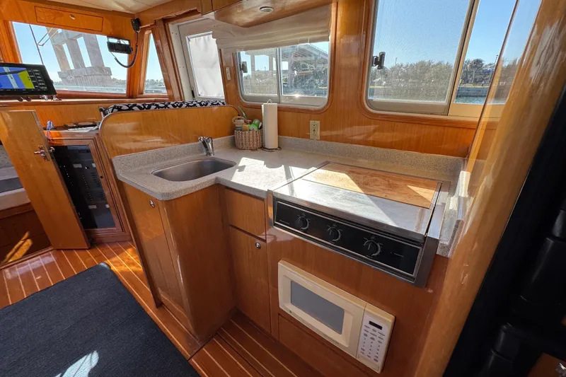 Slide: The Image of Compact kitchen in 2006 Albin 40 North Sea Cutter with stove, sink, and microwave. - 48