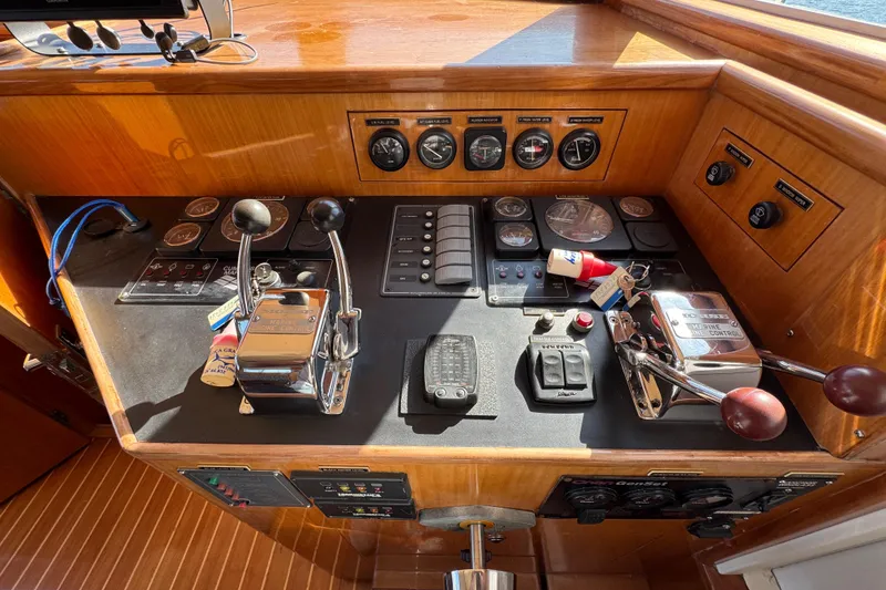 Slide: The Image of Control panel of a 2006 Albin 40 North Sea Cutter boat with gauges and levers. - 51