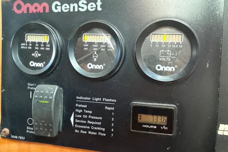 Slide: The Image of Onan GenSet control panel with gauges on a 2006 Albin 40 North Sea Cutter. - 59