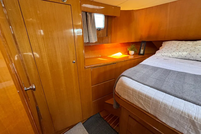 Slide: The Image of Cozy cabin interior of 2006 Albin 40 North Sea Cutter with wooden finish and bed. - 62