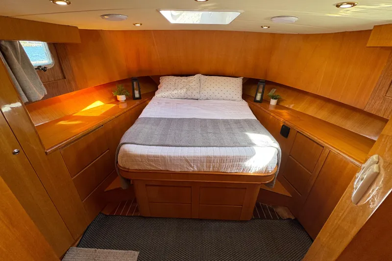 Slide: The Image of Cozy cabin interior of 2006 Albin 40 North Sea Cutter with wooden finish and double bed. - 63