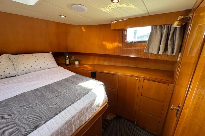 Slide: The Image of Cozy cabin interior of 2006 Albin 40 North Sea Cutter with wood finish and bed. - 64