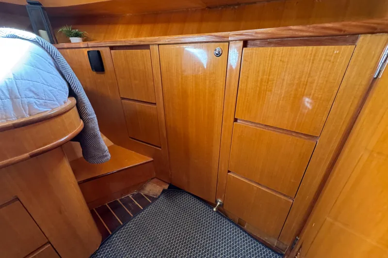 Slide: The Image of Interior of 2006 Albin 40 North Sea Cutter with wooden cabinetry and cozy bedding. - 65