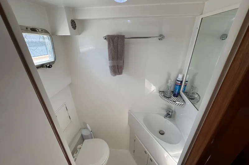 Slide: The Image of Bathroom interior of 2006 Albin 40 North Sea Cutter with sink, toilet, and window. - 66